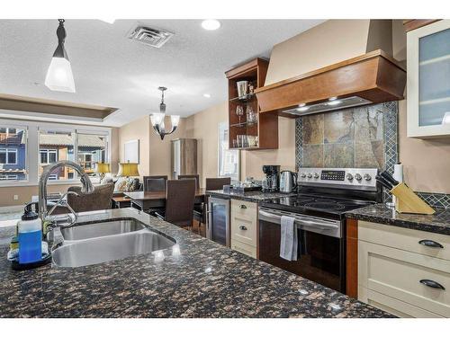 301-173 Kananaskis Way, Canmore, AB - Indoor Photo Showing Kitchen With Stainless Steel Kitchen With Double Sink