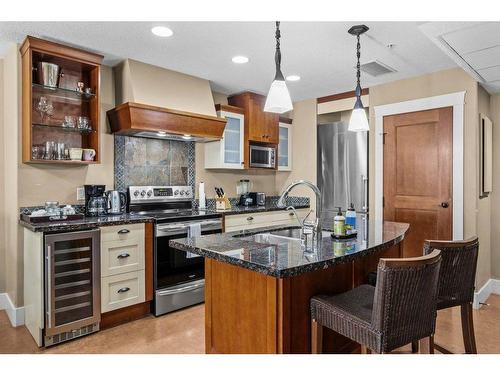 301-173 Kananaskis Way, Canmore, AB - Indoor Photo Showing Kitchen With Stainless Steel Kitchen With Double Sink