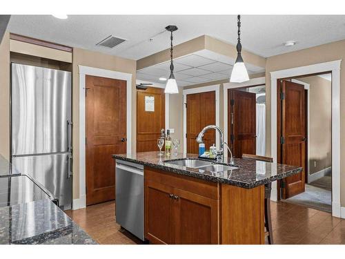 301-173 Kananaskis Way, Canmore, AB - Indoor Photo Showing Kitchen With Double Sink