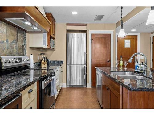 301-173 Kananaskis Way, Canmore, AB - Indoor Photo Showing Kitchen With Stainless Steel Kitchen With Double Sink With Upgraded Kitchen