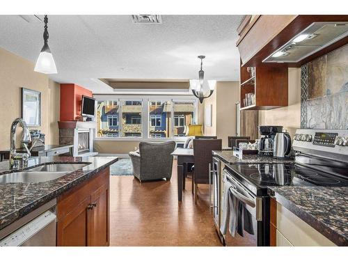 301-173 Kananaskis Way, Canmore, AB - Indoor Photo Showing Kitchen With Double Sink