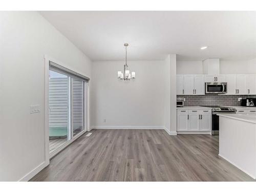 63 Belgian Crescent, Cochrane, AB - Indoor Photo Showing Kitchen