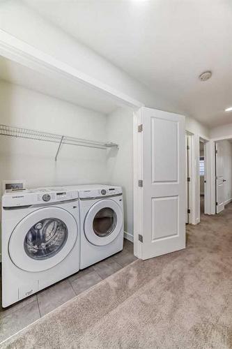 63 Belgian Crescent, Cochrane, AB - Indoor Photo Showing Laundry Room