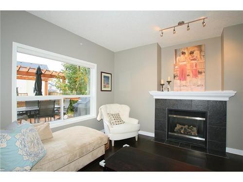 254 Cougarstone Gardens Sw, Calgary, AB - Indoor Photo Showing Living Room With Fireplace