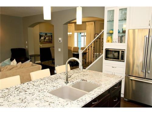 254 Cougarstone Gardens Sw, Calgary, AB - Indoor Photo Showing Kitchen With Stainless Steel Kitchen With Double Sink With Upgraded Kitchen