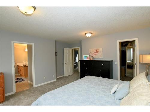 254 Cougarstone Gardens Sw, Calgary, AB - Indoor Photo Showing Bedroom