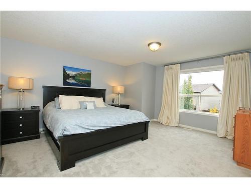 254 Cougarstone Gardens Sw, Calgary, AB - Indoor Photo Showing Bedroom