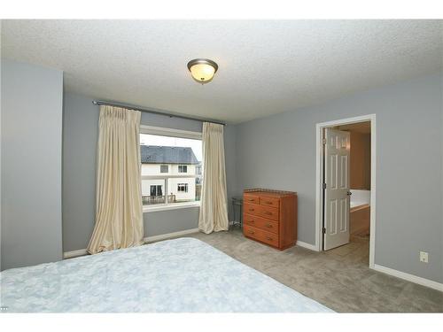 254 Cougarstone Gardens Sw, Calgary, AB - Indoor Photo Showing Bedroom