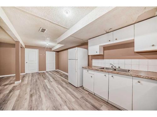 112 Falwood Crescent Ne, Calgary, AB - Indoor Photo Showing Kitchen With Double Sink