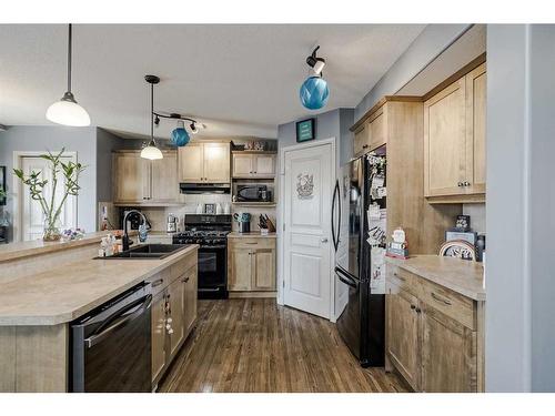 2196 Luxstone Boulevard Sw, Airdrie, AB - Indoor Photo Showing Kitchen With Double Sink