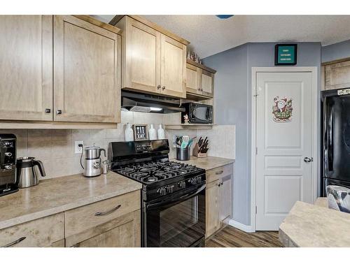 2196 Luxstone Boulevard Sw, Airdrie, AB - Indoor Photo Showing Kitchen