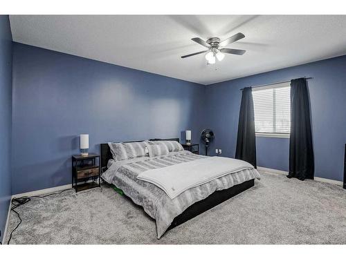 2196 Luxstone Boulevard Sw, Airdrie, AB - Indoor Photo Showing Bedroom