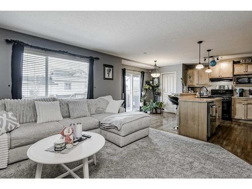 2196 Luxstone Boulevard Sw, Airdrie, AB - Indoor Photo Showing Living Room