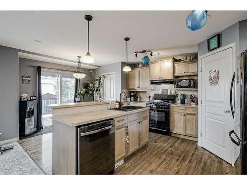 2196 Luxstone Boulevard Sw, Airdrie, AB - Indoor Photo Showing Kitchen With Double Sink