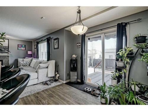 2196 Luxstone Boulevard Sw, Airdrie, AB - Indoor Photo Showing Other Room With Fireplace