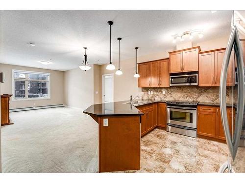 311-35 Aspenmont Heights Sw, Calgary, AB - Indoor Photo Showing Kitchen With Upgraded Kitchen