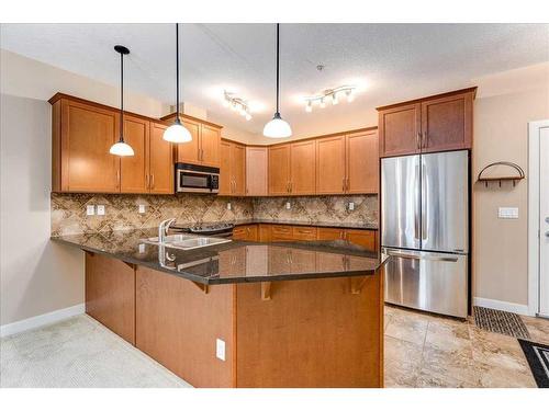 311-35 Aspenmont Heights Sw, Calgary, AB - Indoor Photo Showing Kitchen With Double Sink