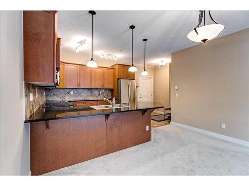 311-35 Aspenmont Heights Sw, Calgary, AB - Indoor Photo Showing Kitchen With Double Sink