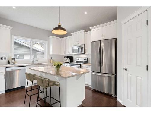 108 Heartland Way, Cochrane, AB - Indoor Photo Showing Kitchen With Upgraded Kitchen