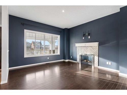 108 Heartland Way, Cochrane, AB - Indoor Photo Showing Living Room With Fireplace