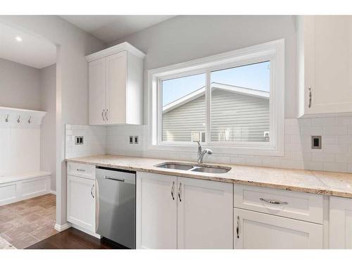 108 Heartland Way, Cochrane, AB - Indoor Photo Showing Kitchen With Double Sink