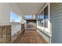 108 Heartland Way, Cochrane, AB  - Outdoor With Deck Patio Veranda With Exterior 