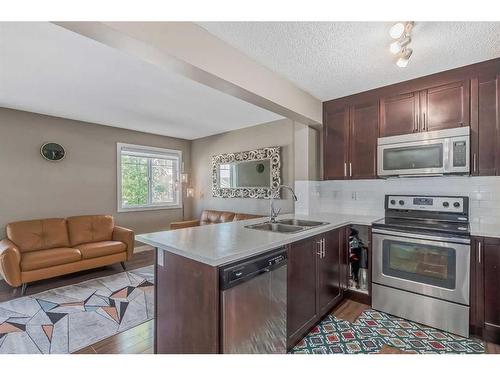 232 Pantego Lane Nw, Calgary, AB - Indoor Photo Showing Kitchen With Stainless Steel Kitchen With Double Sink