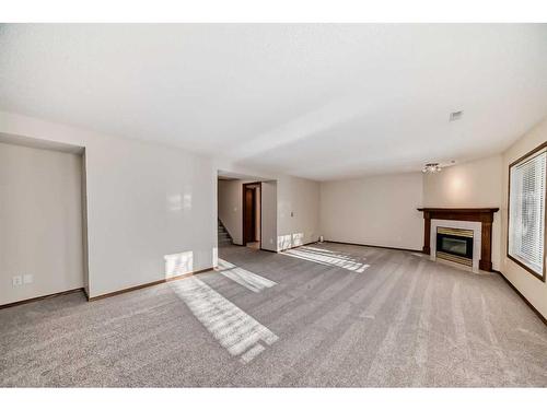 13 Arbour Cliff Close Nw, Calgary, AB - Indoor With Fireplace