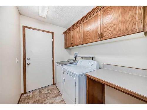 13 Arbour Cliff Close Nw, Calgary, AB - Indoor Photo Showing Laundry Room