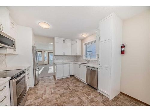 13 Arbour Cliff Close Nw, Calgary, AB - Indoor Photo Showing Kitchen With Stainless Steel Kitchen