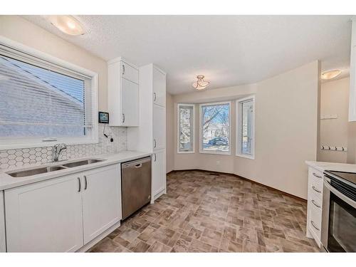 13 Arbour Cliff Close Nw, Calgary, AB - Indoor Photo Showing Kitchen With Stainless Steel Kitchen With Double Sink