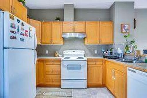 104-111 Tarawood Lane Ne, Calgary, AB - Indoor Photo Showing Kitchen With Double Sink