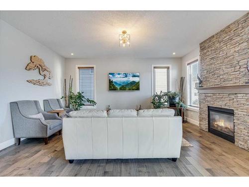 120 Shoreline Vista, Chestermere, AB - Indoor Photo Showing Living Room With Fireplace