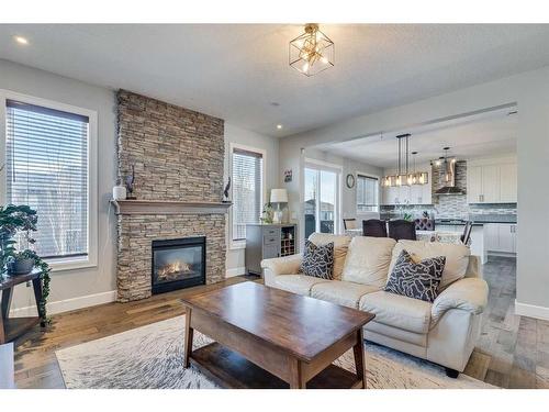 120 Shoreline Vista, Chestermere, AB - Indoor Photo Showing Living Room With Fireplace