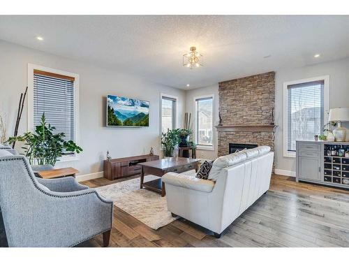 120 Shoreline Vista, Chestermere, AB - Indoor Photo Showing Living Room With Fireplace