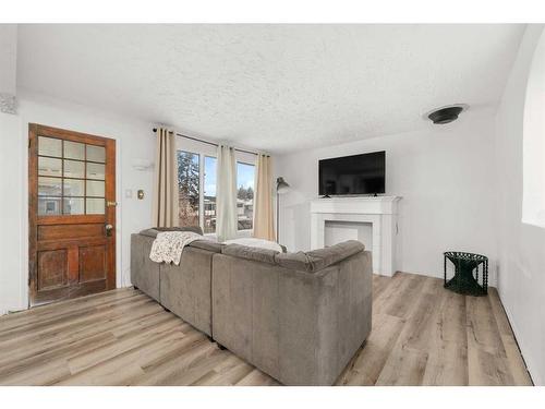 2216 41 Street Se, Calgary, AB - Indoor Photo Showing Living Room With Fireplace