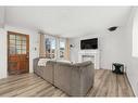 2216 41 Street Se, Calgary, AB  - Indoor Photo Showing Living Room With Fireplace 