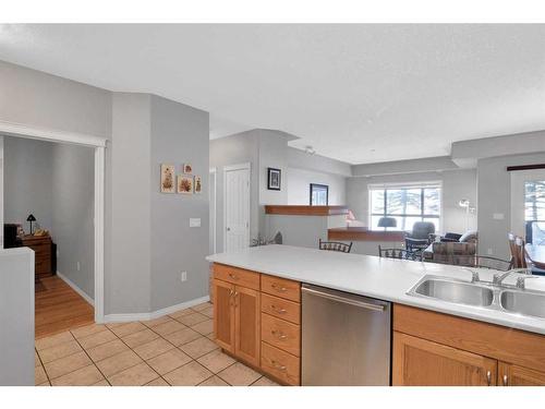 110-60 Sierra Morena Landing Sw, Calgary, AB - Indoor Photo Showing Kitchen With Double Sink