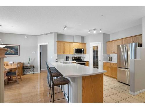 110-60 Sierra Morena Landing Sw, Calgary, AB - Indoor Photo Showing Kitchen With Stainless Steel Kitchen