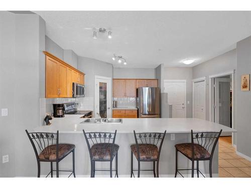 110-60 Sierra Morena Landing Sw, Calgary, AB - Indoor Photo Showing Kitchen With Stainless Steel Kitchen With Double Sink