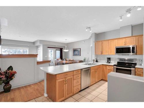 110-60 Sierra Morena Landing Sw, Calgary, AB - Indoor Photo Showing Kitchen With Double Sink