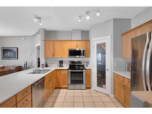 110-60 Sierra Morena Landing Sw, Calgary, AB - Indoor Photo Showing Kitchen With Stainless Steel Kitchen With Double Sink