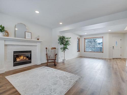 10 Crystalridge Way, Okotoks, AB - Indoor Photo Showing Living Room With Fireplace