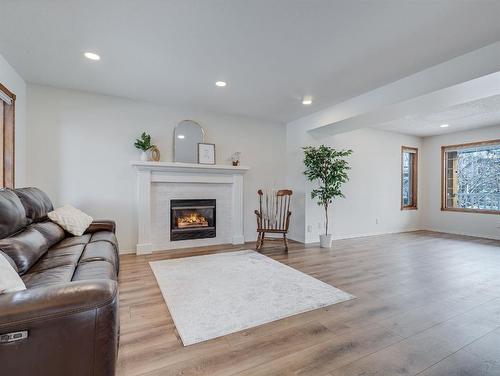 10 Crystalridge Way, Okotoks, AB - Indoor Photo Showing Living Room With Fireplace