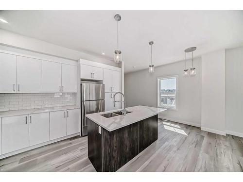 64-351 Monteith Drive Se, High River, AB - Indoor Photo Showing Kitchen With Double Sink With Upgraded Kitchen