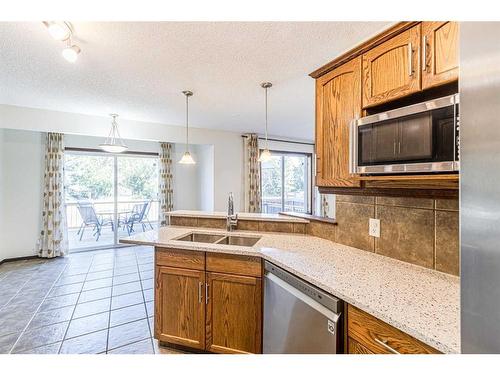 48 Eversyde Manor Sw, Calgary, AB - Indoor Photo Showing Kitchen With Double Sink