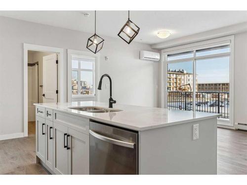 1203-200 Seton Circle Se, Calgary, AB - Indoor Photo Showing Kitchen With Double Sink