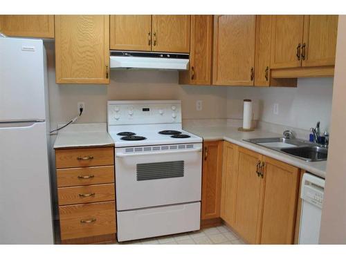 2305-2305 Hawksbrow Point Nw, Calgary, AB - Indoor Photo Showing Kitchen With Double Sink