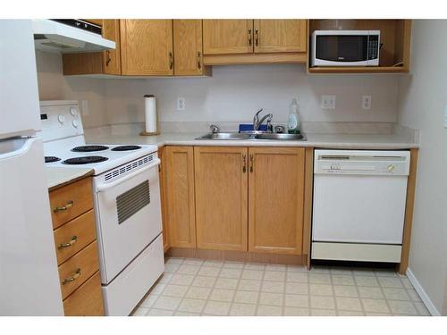 2305-2305 Hawksbrow Point Nw, Calgary, AB - Indoor Photo Showing Kitchen With Double Sink