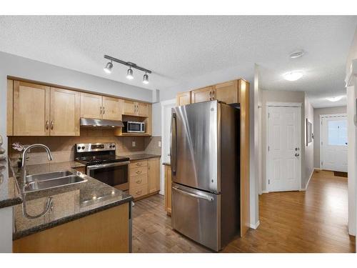 67 Country Village Lane Ne, Calgary, AB - Indoor Photo Showing Kitchen With Stainless Steel Kitchen With Double Sink